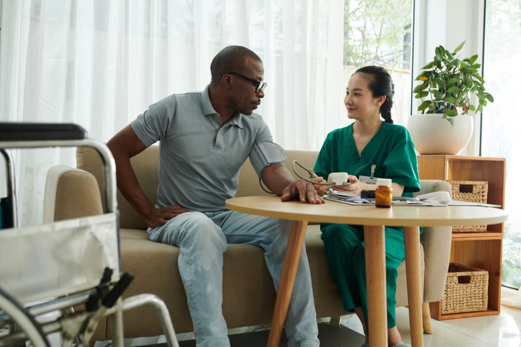 Medical Nurse Visiting Patient